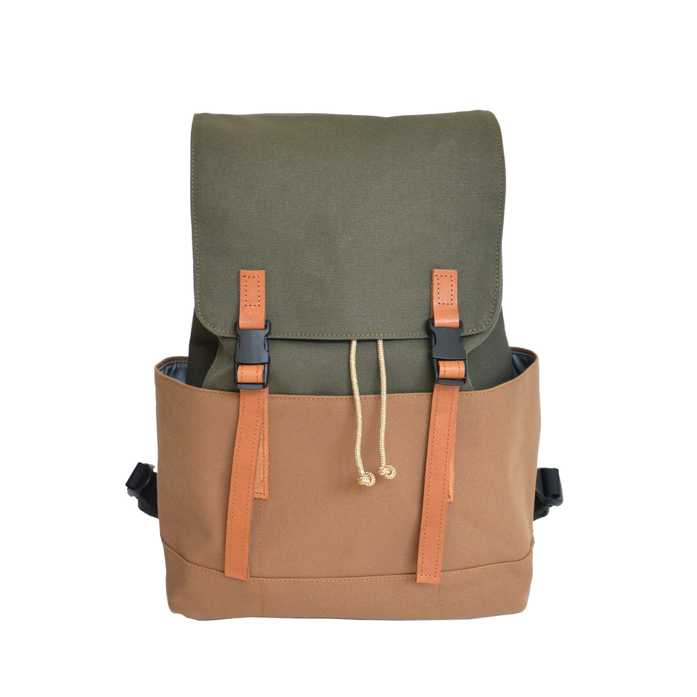 Green and brown backpack with leather straps on a white background