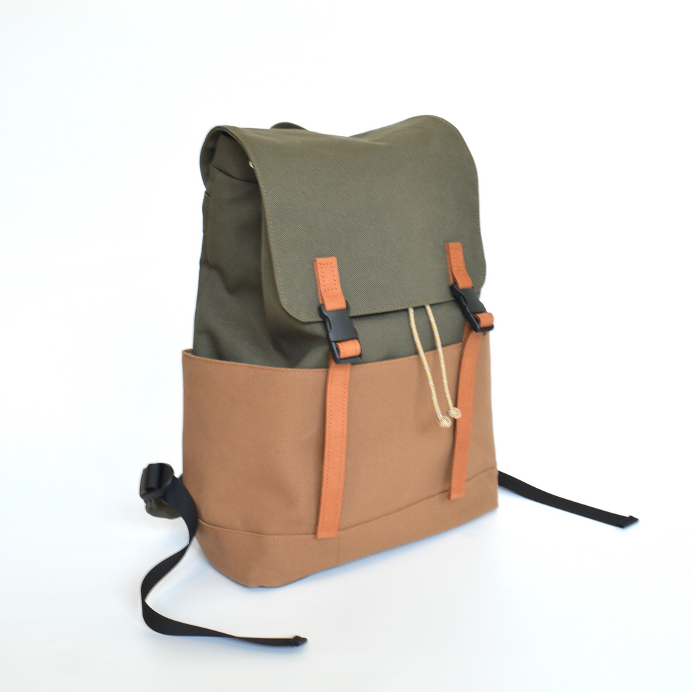 Green and brown backpack on a white background