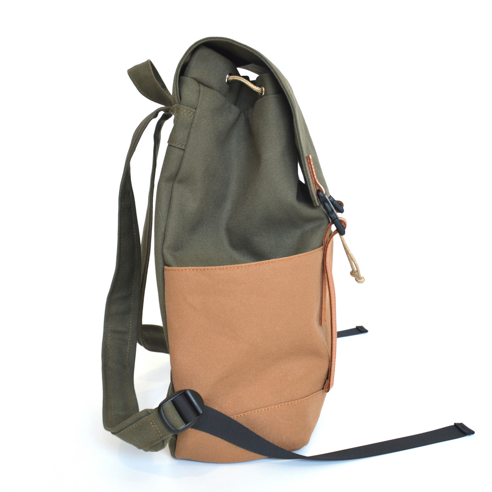 Two-toned backpack with green top section and brown bottom section on a white background