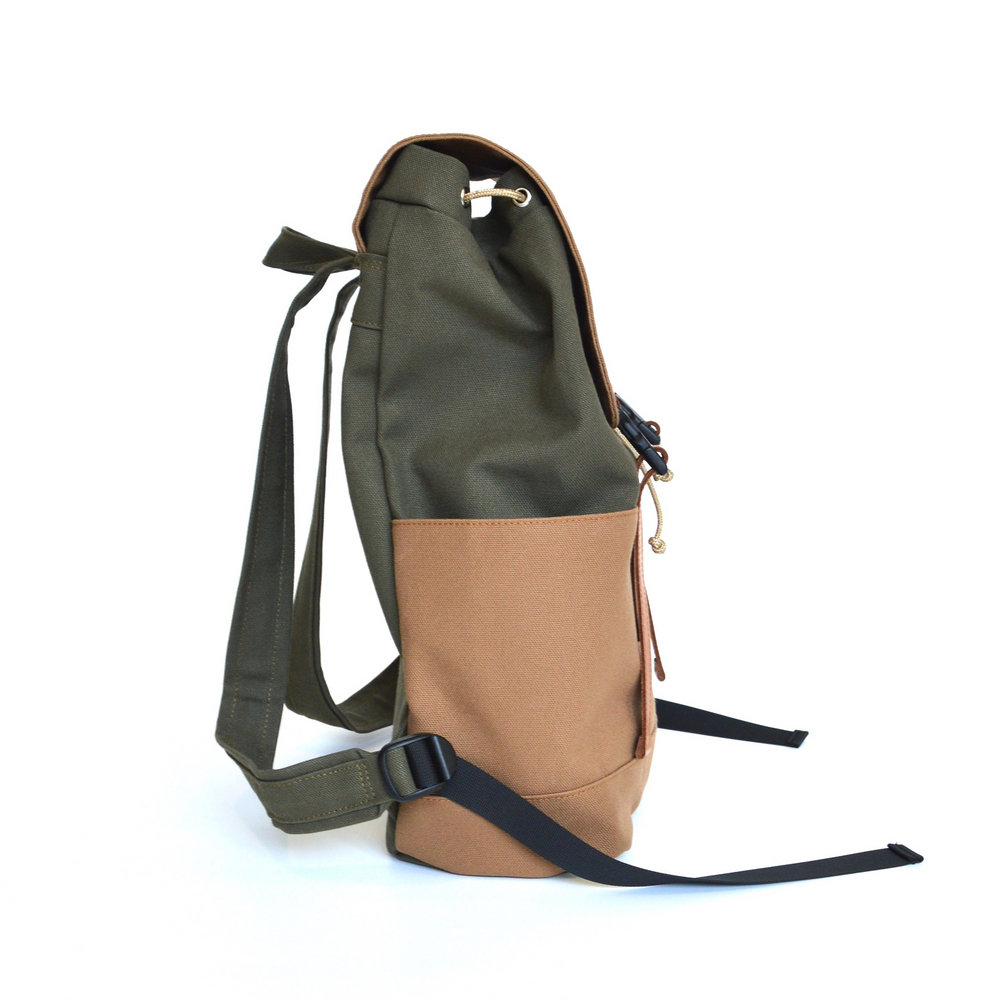 Backpack with green top section and brown bottom section on a white background