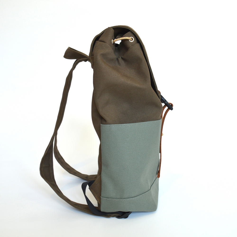 Two-toned backpack with brown top and gray bottom on a white background