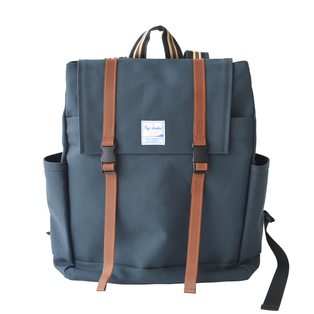 Navy blue backpack with brown straps on a white background.