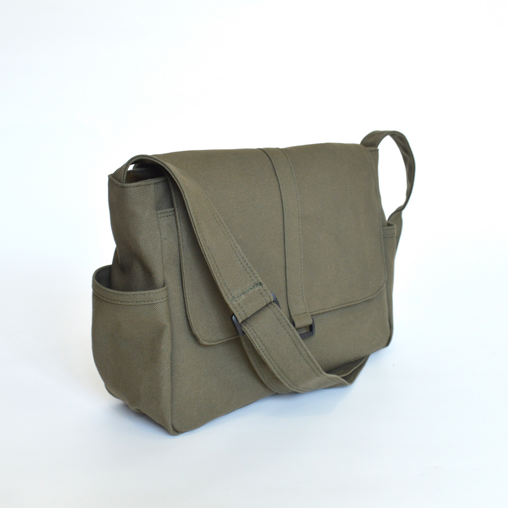Green messenger bag on a white background