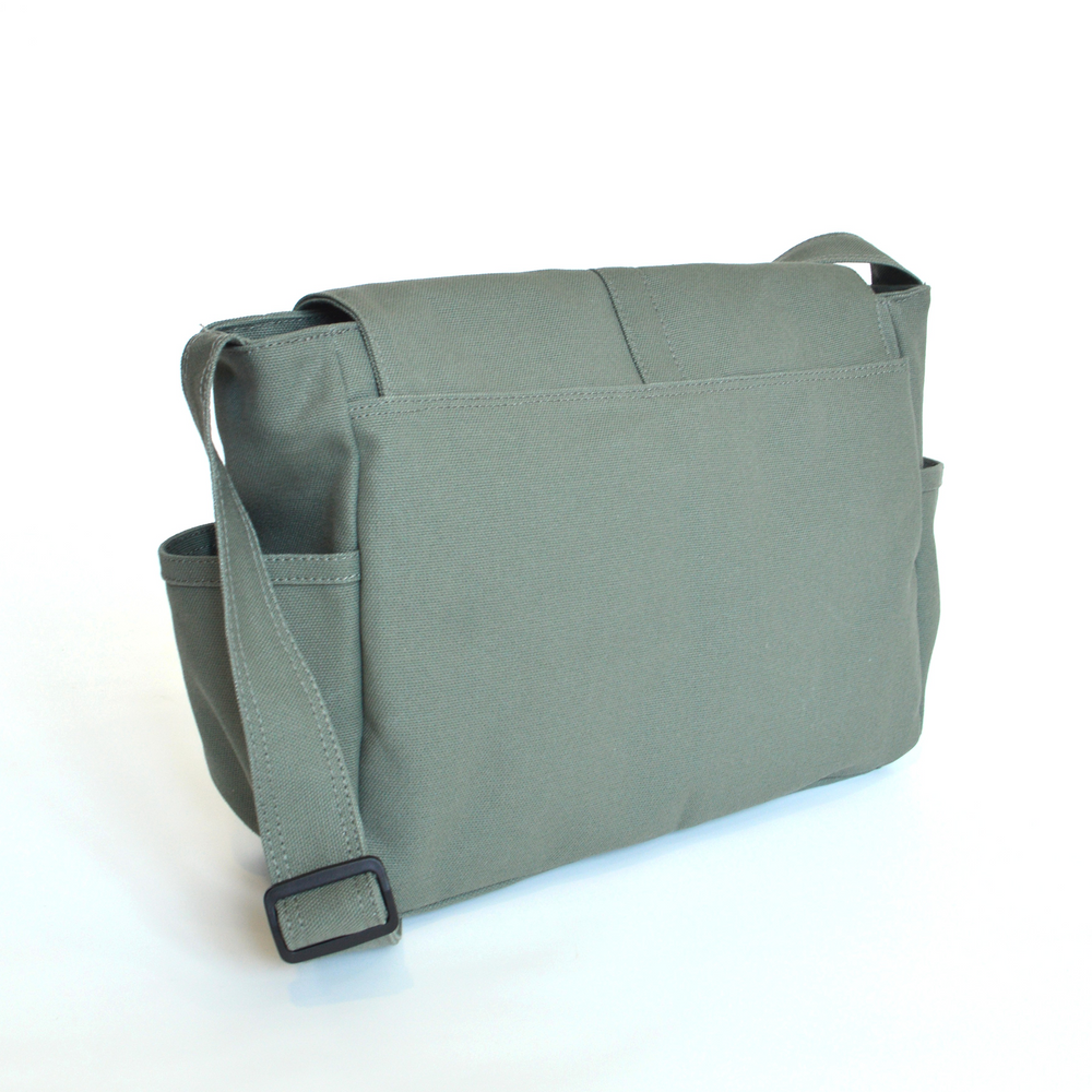 Green messenger bag on a white background