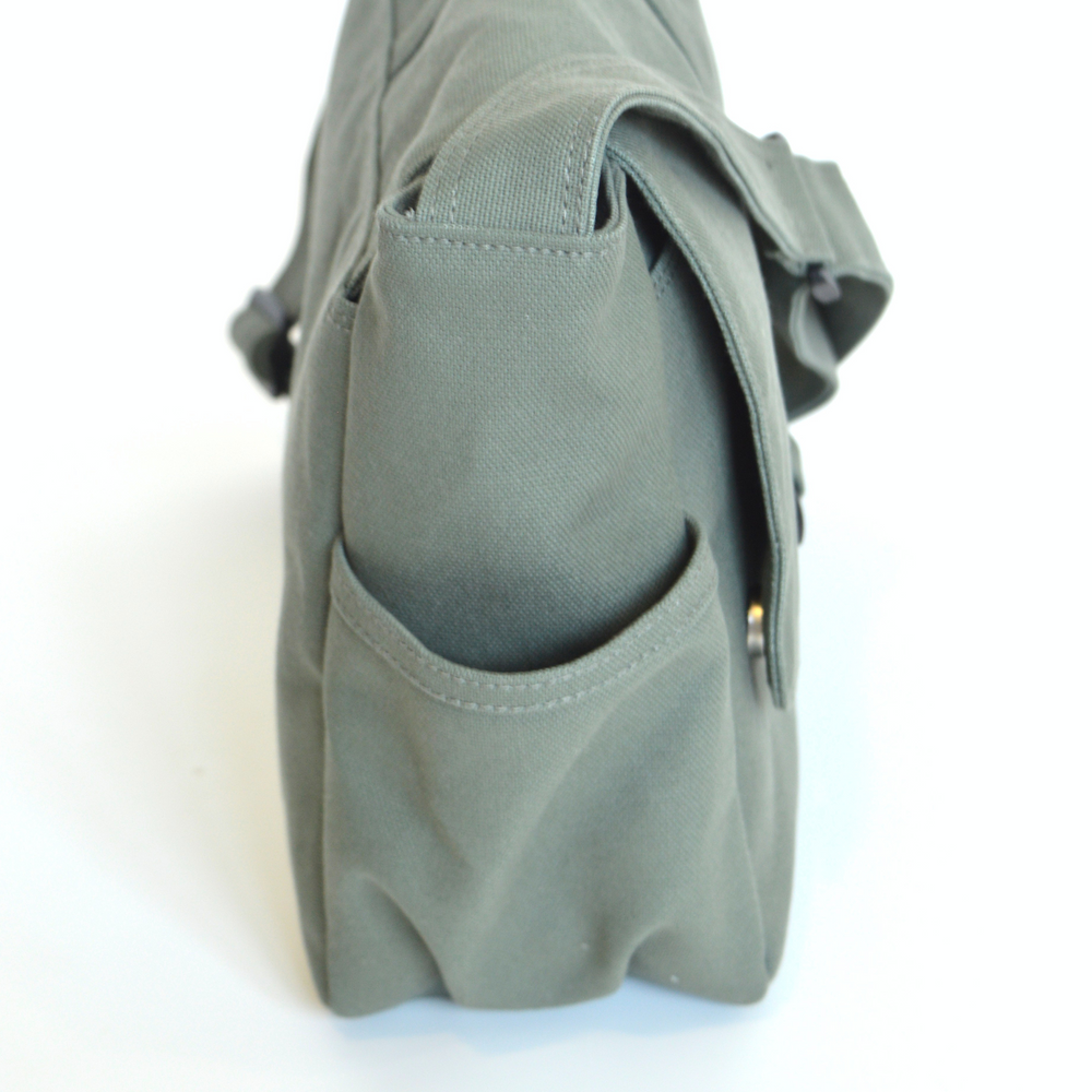 Green bag with a pocket on a white background