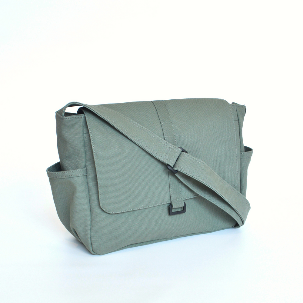 Green shoulder bag on a white background