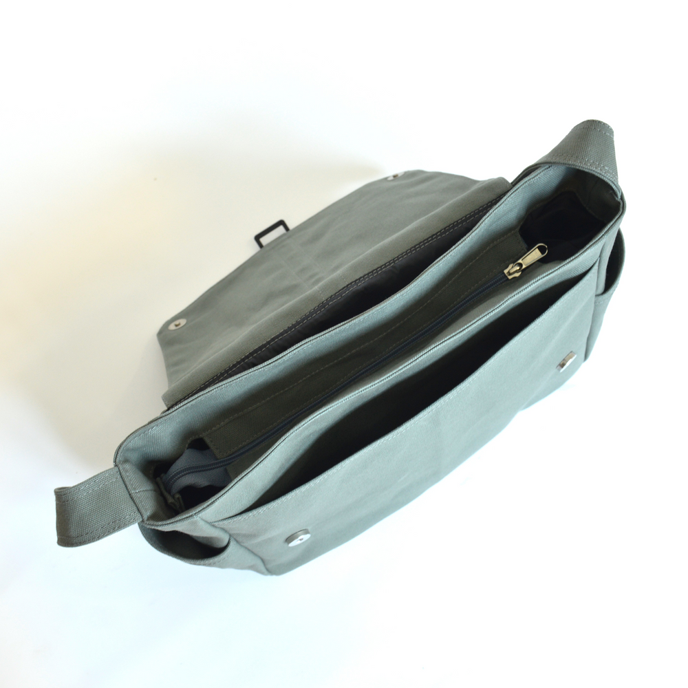 Gray shoulder bag with a visible zipper on a white background