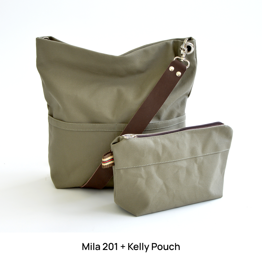 Green handbag with brown strap and matching pouch on a white background