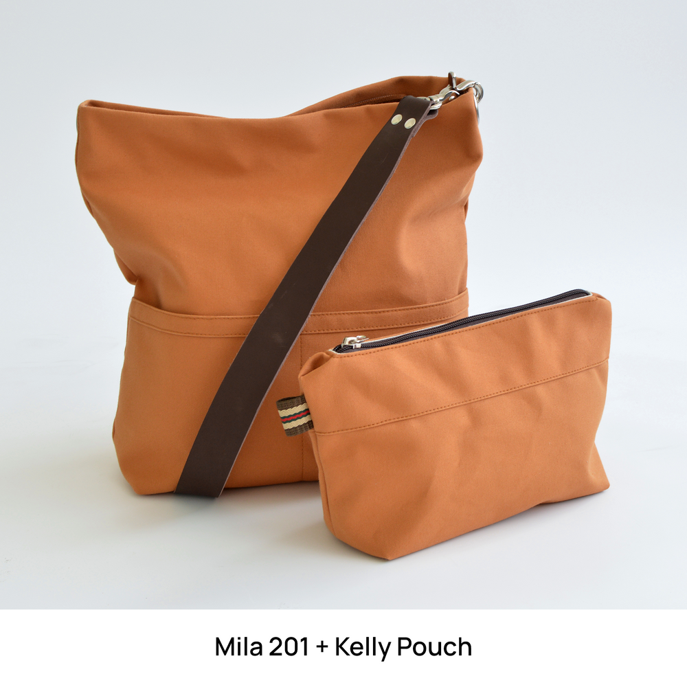 Orange shoulder bag bag with a matching pouch on a white background
