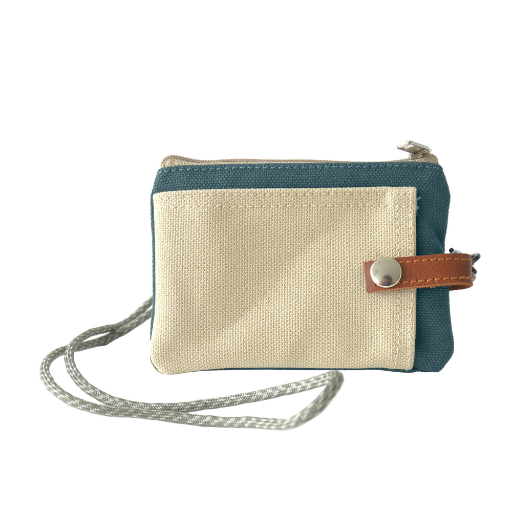 Two-tone card holder with beige and blue design on a white background